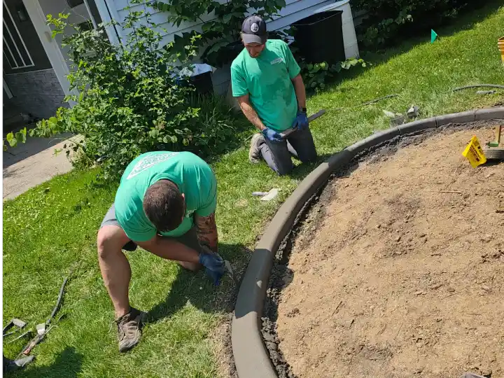 Fresh decorative concrete curbing with stamping tools and texture mats