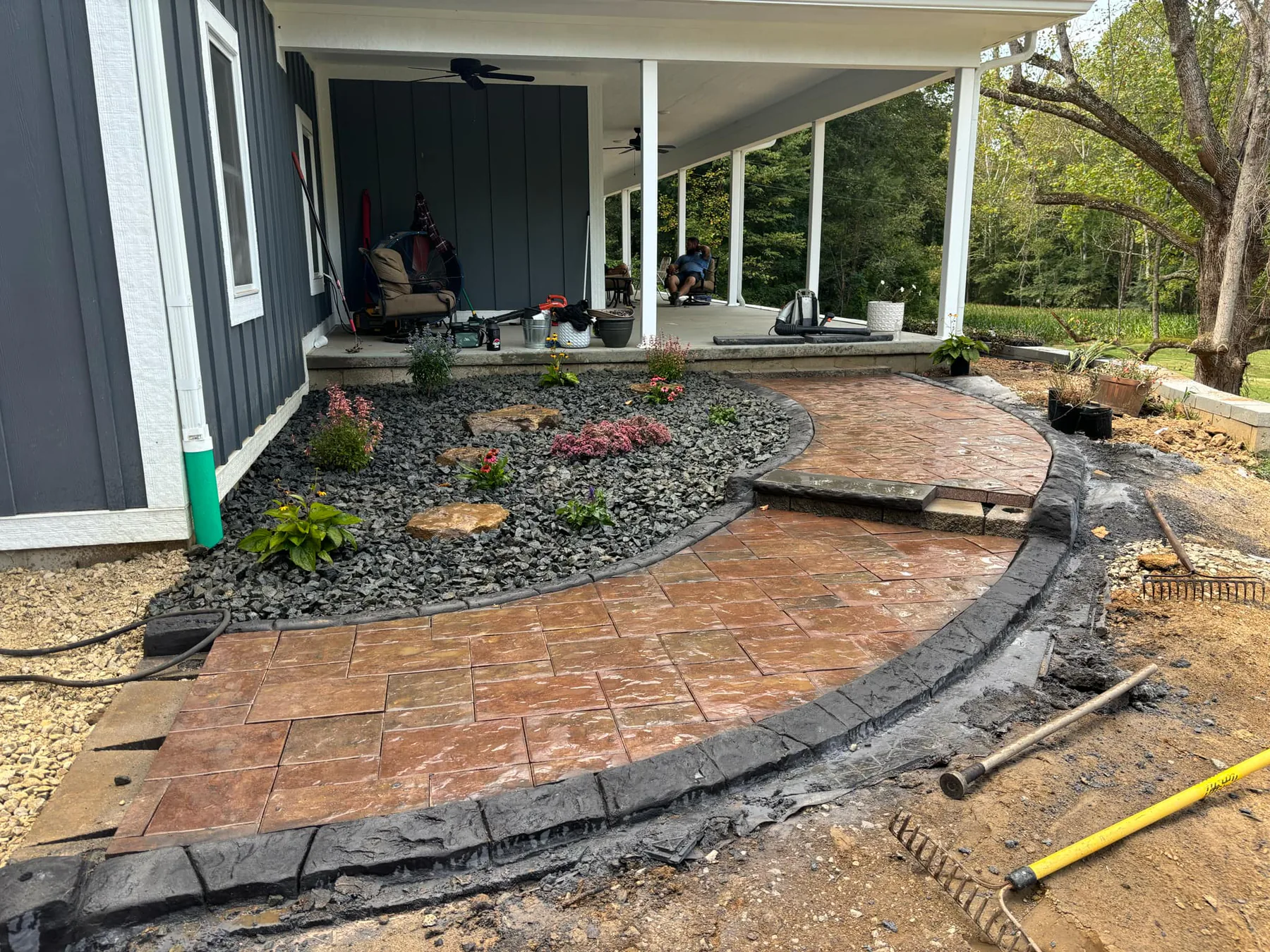 Stamped concrete edging around a covered residential patio