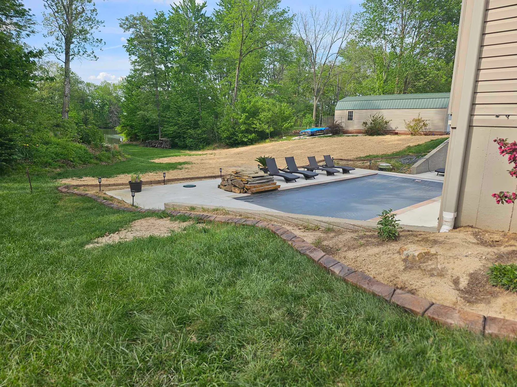 Long landscape curb bordering a residential pool area