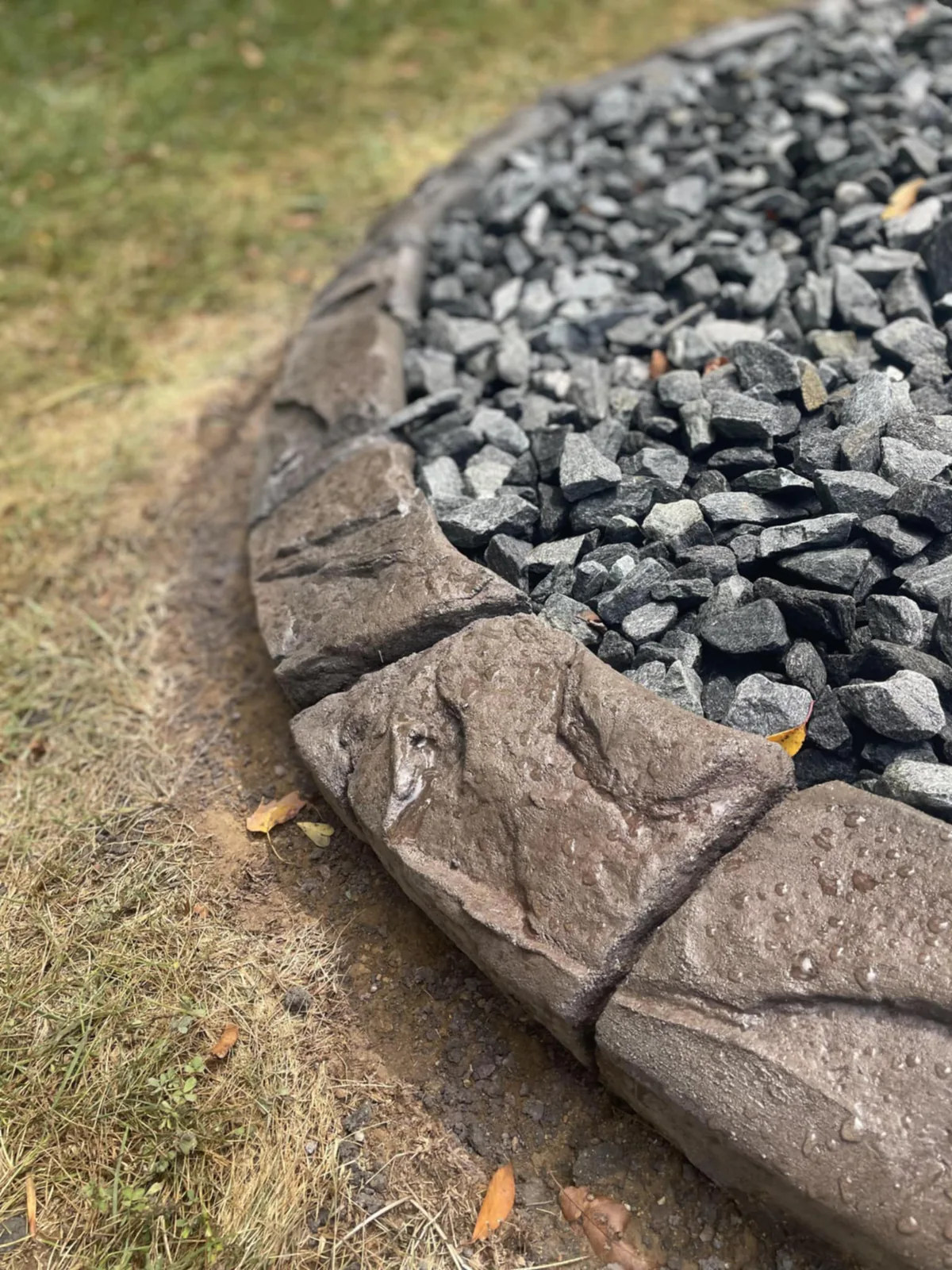 Close view of natural-looking color variation on finished concrete curbing