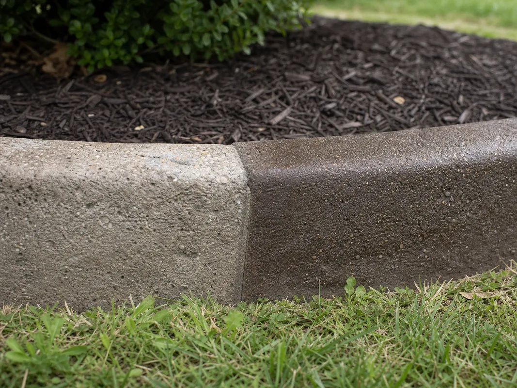 concrete curb resealing inspection showing decorative landscape edging in Southern Indiana