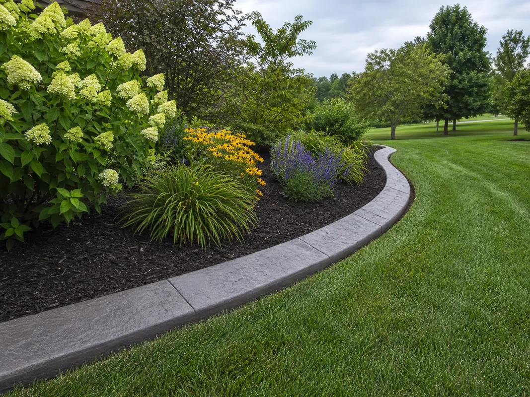 curved concrete landscape border for an Ellettsville, Indiana property.